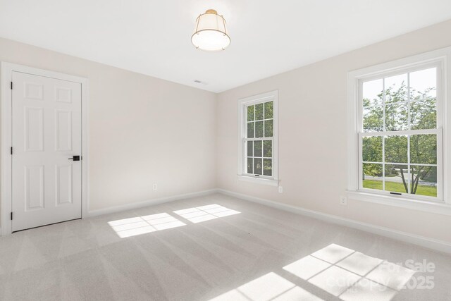 426 Walden Trl, Waxhaw, NC 28173 - carpeted empty room with baseboards and a healthy amount of sunlight