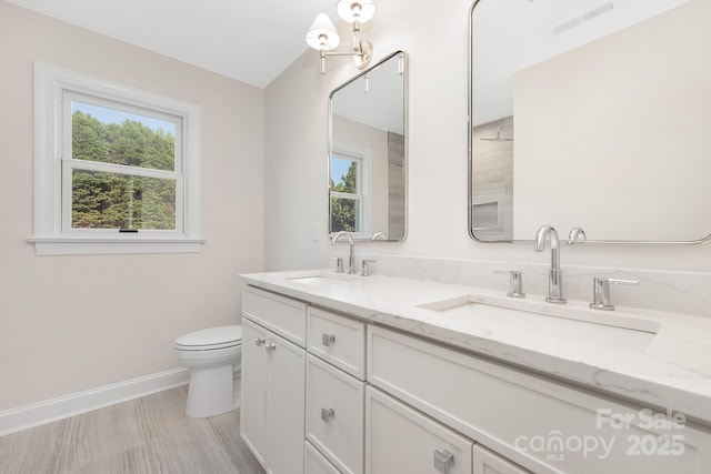 426 Walden Trl, Waxhaw, NC 28173 - bathroom featuring visible vents, a sink, baseboards, and toilet
