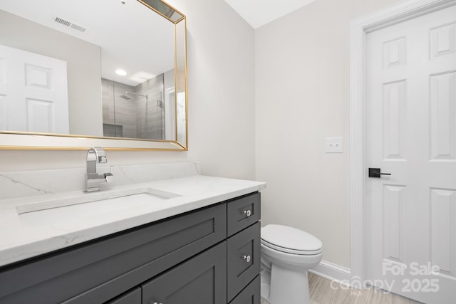 426 Walden Trl, Waxhaw, NC 28173 - bathroom featuring vanity, toilet, baseboards, a shower stall, and visible vents