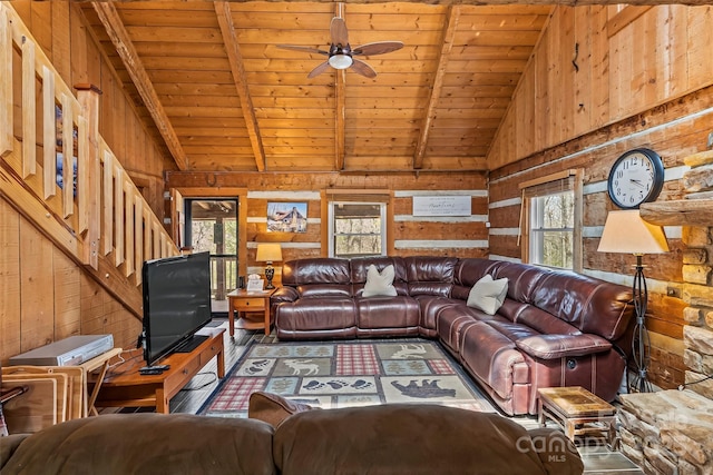 living room featuring wood walls and wooden ceiling