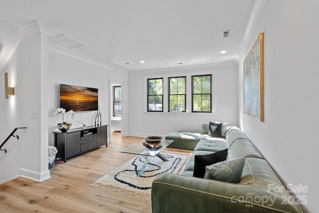 living room with recessed lighting, light wood finished floors, baseboards, and ornamental molding