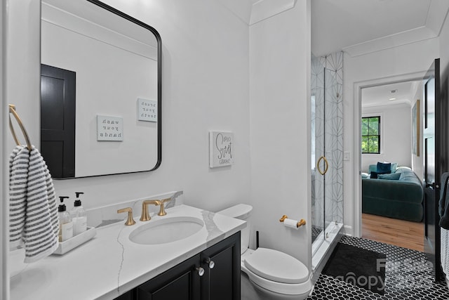 full bath with tile patterned floors, toilet, a shower stall, crown molding, and vanity