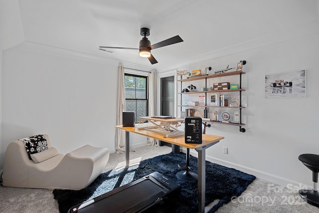 carpeted office space with visible vents, baseboards, and ceiling fan