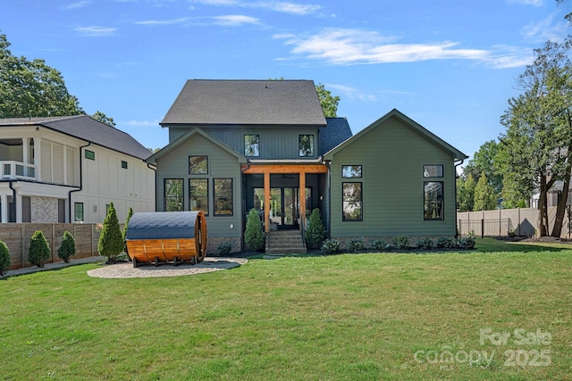 back of property featuring a fenced backyard, a yard, and cooling unit