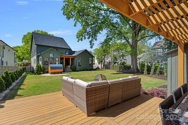 wooden terrace featuring a pergola, a fenced backyard, a yard, and an outdoor living space with a fire pit