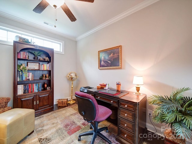 office featuring ceiling fan, baseboards, ornamental molding, and visible vents