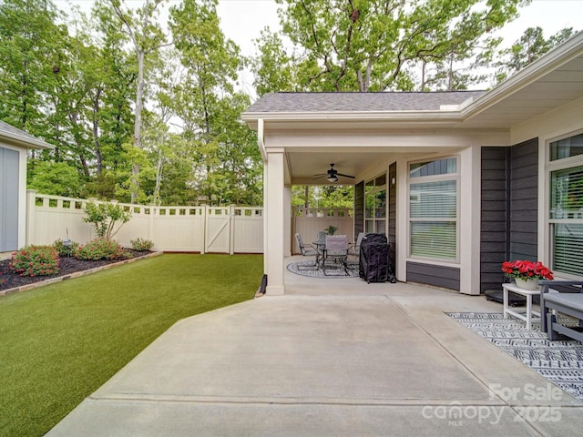 view of patio / terrace featuring a ceiling fan, outdoor dining space, and a fenced backyard