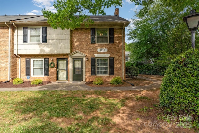 view of front of house featuring brick siding