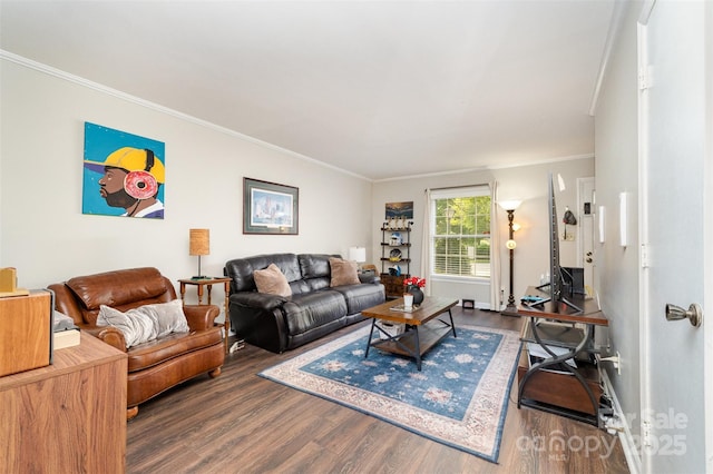 living area featuring baseboards, wood finished floors, and ornamental molding