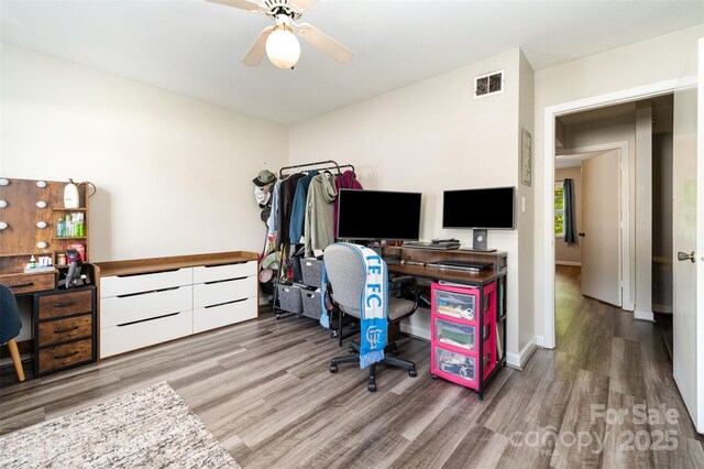 office with wood finished floors, visible vents, and a ceiling fan