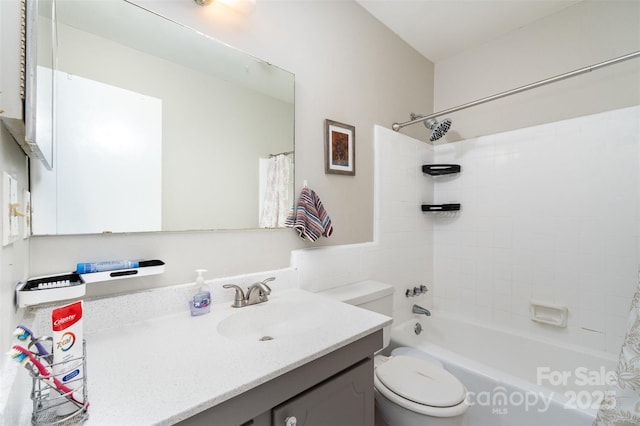 bathroom featuring shower / tub combo, toilet, and vanity
