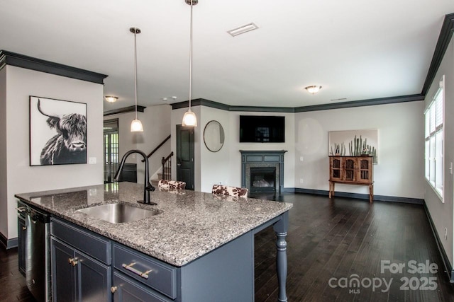 10707 Charmont Pl, Huntersville, NC 28078 - kitchen with a sink, baseboards, a breakfast bar area, light stone counters, and ornamental molding