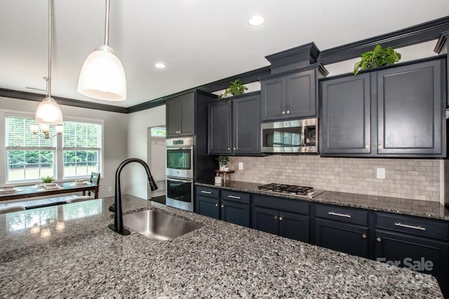 10707 Charmont Pl, Huntersville, NC 28078 - kitchen featuring appliances with stainless steel finishes, a sink, ornamental molding, dark stone counters, and tasteful backsplash