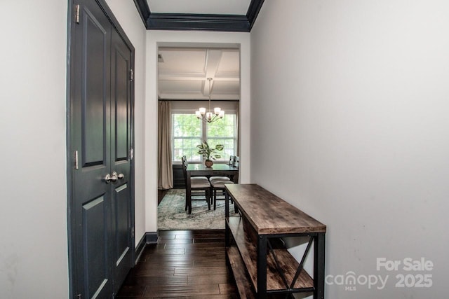 10707 Charmont Pl, Huntersville, NC 28078 - doorway featuring a chandelier, ornamental molding, dark wood finished floors, coffered ceiling, and beamed ceiling