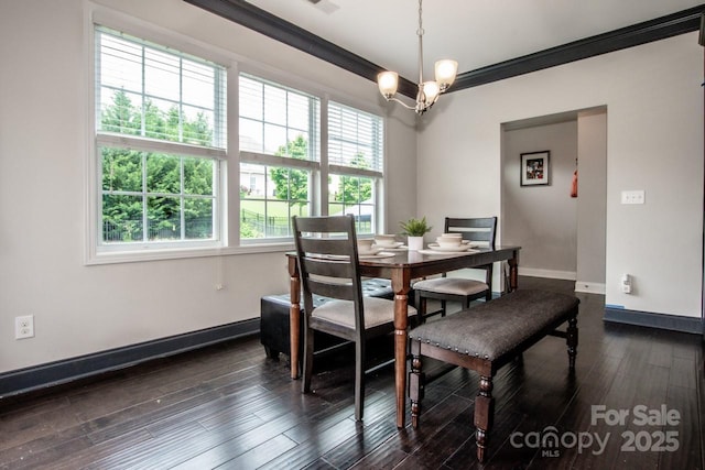 10707 Charmont Pl, Huntersville, NC 28078 - dining area with baseboards, dark wood-style flooring, and crown molding