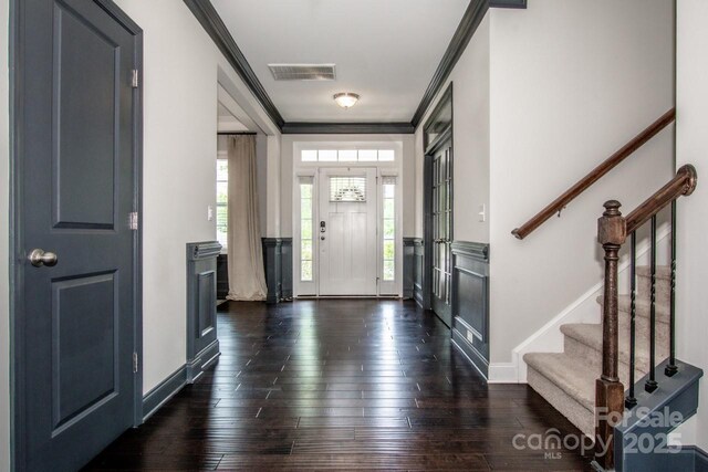 10707 Charmont Pl, Huntersville, NC 28078 - foyer featuring crown molding, stairway, dark wood-style flooring, and baseboards