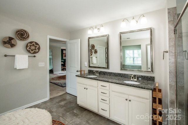 10707 Charmont Pl, Huntersville, NC 28078 - bathroom featuring double vanity, tiled shower, and baseboards