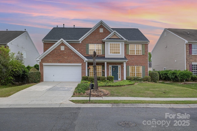 traditional home featuring brick siding, a lawn, roof with shingles, and driveway
