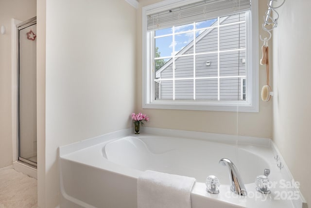 full bath with a stall shower and a bath