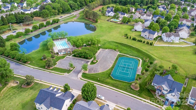 bird's eye view with a water view and a residential view