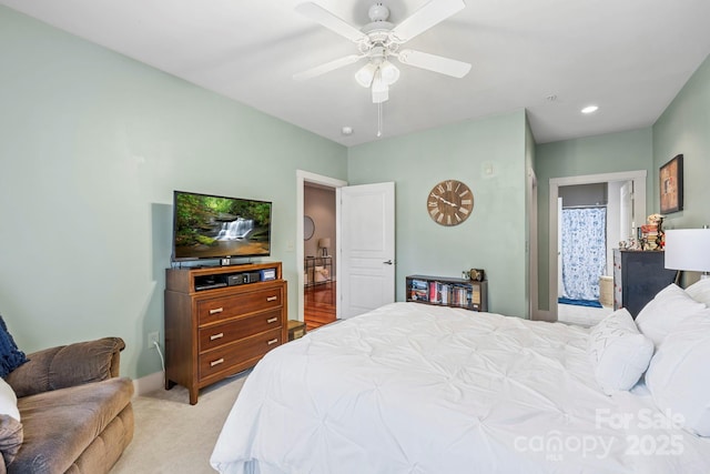 bedroom with recessed lighting, ceiling fan, and light carpet