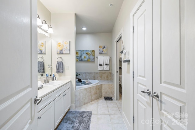 full bath featuring tile patterned floors, toilet, recessed lighting, a garden tub, and vanity