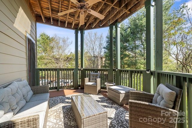 deck with outdoor lounge area and ceiling fan