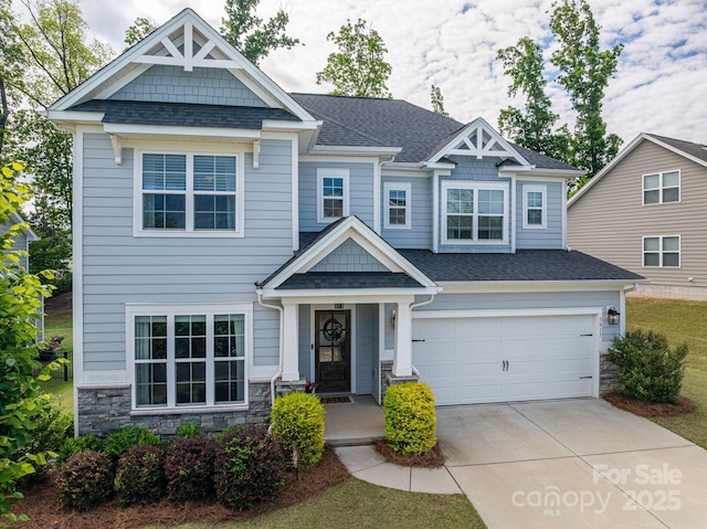 3017 Winged Teal Ct, Belmont, NC 28012 - craftsman-style home featuring stone siding, driveway, an attached garage, and roof with shingles
