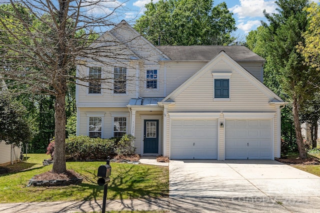 traditional-style home with a front lawn and concrete driveway