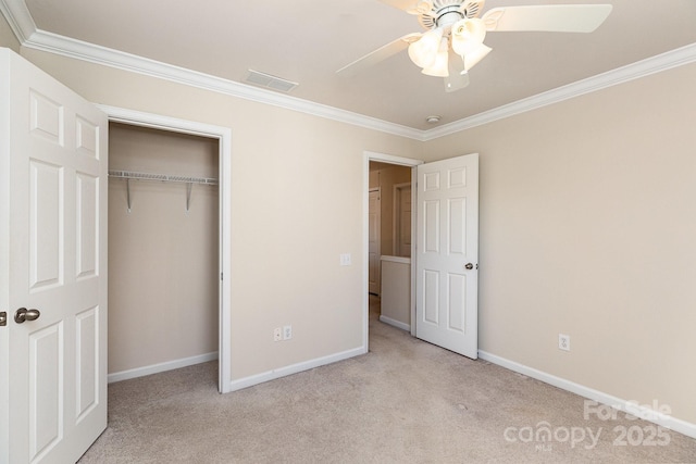 unfurnished bedroom with carpet floors, visible vents, baseboards, and ornamental molding