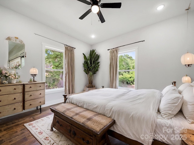 bedroom featuring multiple windows, dark wood-style flooring, recessed lighting, ceiling fan, and baseboards