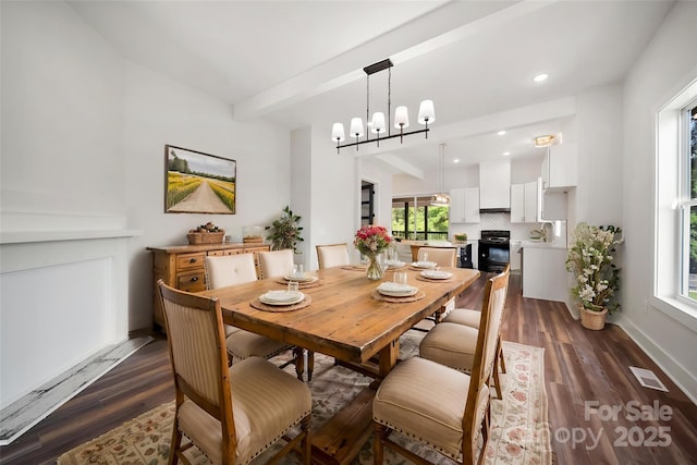 dining area featuring dark wood-style flooring, a chandelier, recessed lighting, and baseboards