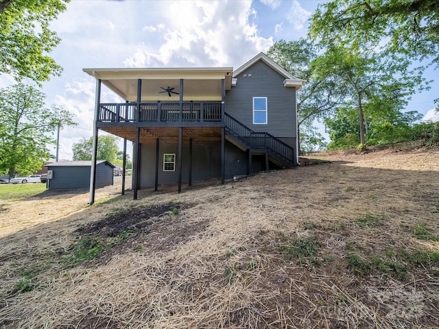 back of house with ceiling fan, stairway, and a deck