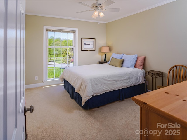 bedroom featuring light carpet, ornamental molding, baseboards, and a ceiling fan