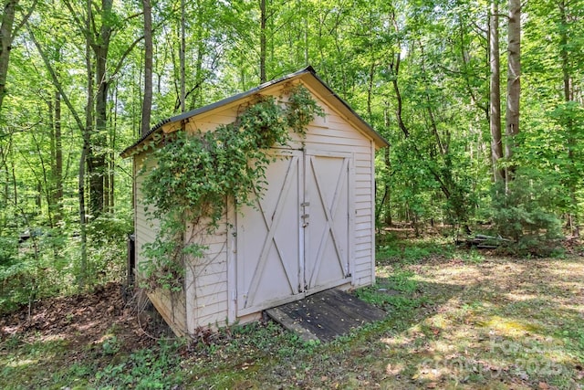 182 Freedom Mill Rd, Gastonia, NC 28052 - view of shed featuring a view of trees