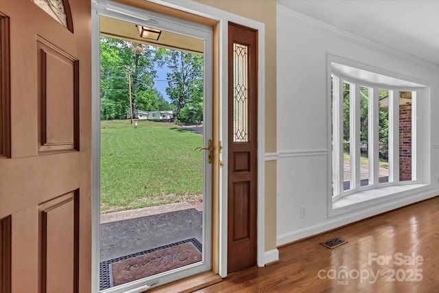 182 Freedom Mill Rd, Gastonia, NC 28052 - entrance foyer featuring baseboards, visible vents, wood finished floors, and crown molding
