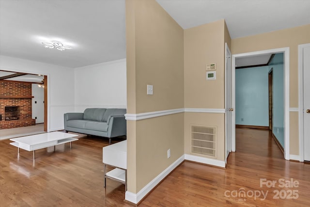 182 Freedom Mill Rd, Gastonia, NC 28052 - hallway featuring wood finished floors, visible vents, and baseboards