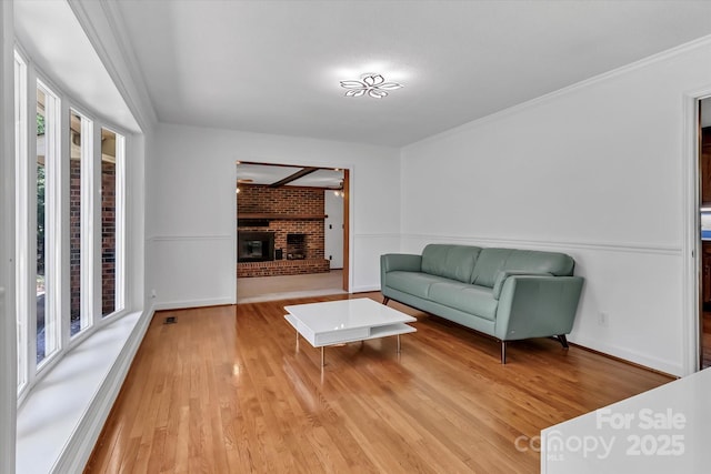 182 Freedom Mill Rd, Gastonia, NC 28052 - living room with a fireplace, light wood-style floors, and baseboards