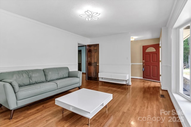182 Freedom Mill Rd, Gastonia, NC 28052 - living area featuring wood finished floors, visible vents, and ornamental molding