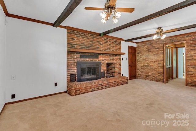 182 Freedom Mill Rd, Gastonia, NC 28052 - unfurnished living room featuring ceiling fan, beam ceiling, brick wall, a brick fireplace, and carpet