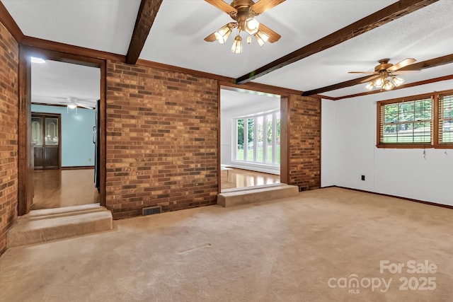 182 Freedom Mill Rd, Gastonia, NC 28052 - carpeted empty room with a wealth of natural light, a ceiling fan, and brick wall
