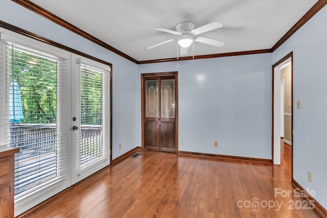 182 Freedom Mill Rd, Gastonia, NC 28052 - unfurnished room with wood finished floors, a ceiling fan, ornamental molding, and baseboards