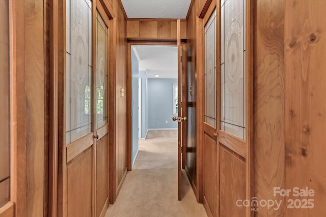 182 Freedom Mill Rd, Gastonia, NC 28052 - hallway with light colored carpet, a textured ceiling, and baseboards