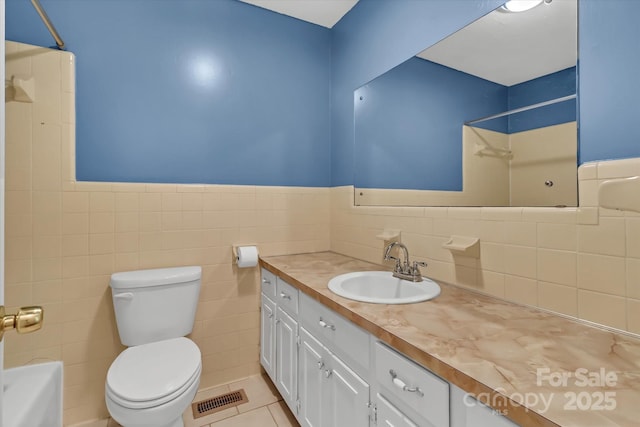 182 Freedom Mill Rd, Gastonia, NC 28052 - bathroom featuring tile walls, visible vents, toilet, and walk in shower