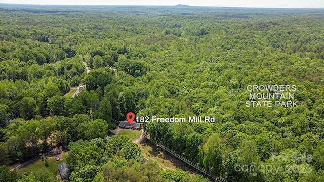 182 Freedom Mill Rd, Gastonia, NC 28052 - birds eye view of property featuring a forest view