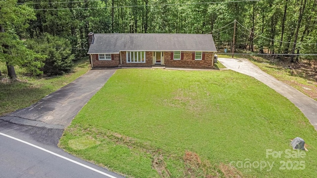 182 Freedom Mill Rd, Gastonia, NC 28052 - view of front of property with brick siding, aphalt driveway, a front lawn, and a view of trees