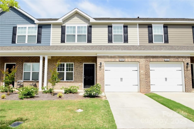525 San Marco Dr, Gastonia, NC 28056 - view of front of home with a garage, a front lawn, brick siding, and concrete driveway