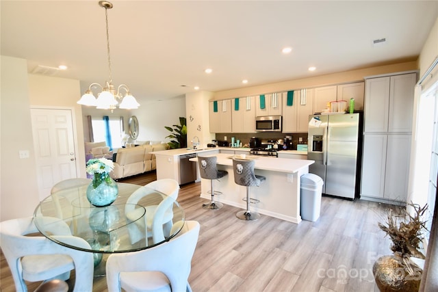 525 San Marco Dr, Gastonia, NC 28056 - dining area featuring recessed lighting, visible vents, light wood finished floors, and a notable chandelier