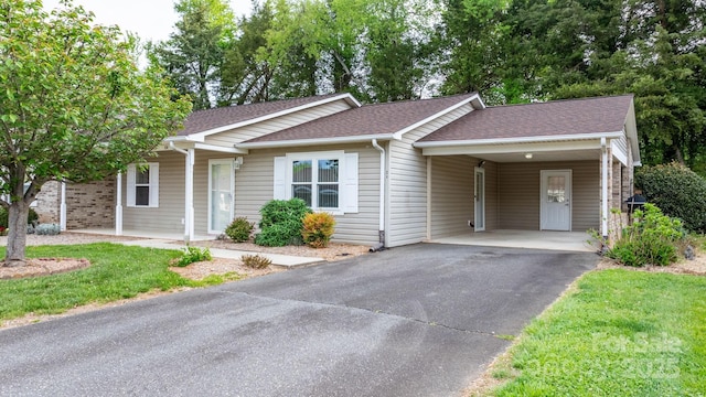 505 2nd Street Pl NE Unit C4, Conover, NC 28613 - view of front of property with asphalt driveway, a carport, a shingled roof, and a front lawn