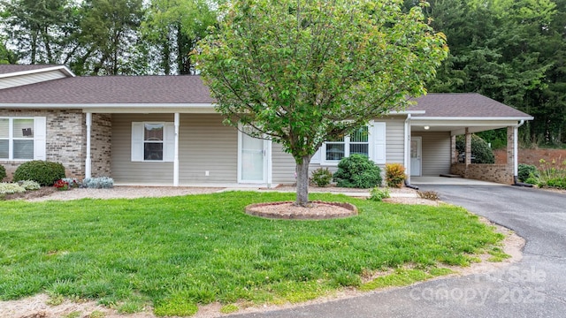 505 2nd Street Pl NE Unit C4, Conover, NC 28613 - view of front facade featuring asphalt driveway, a front yard, brick siding, and a carport